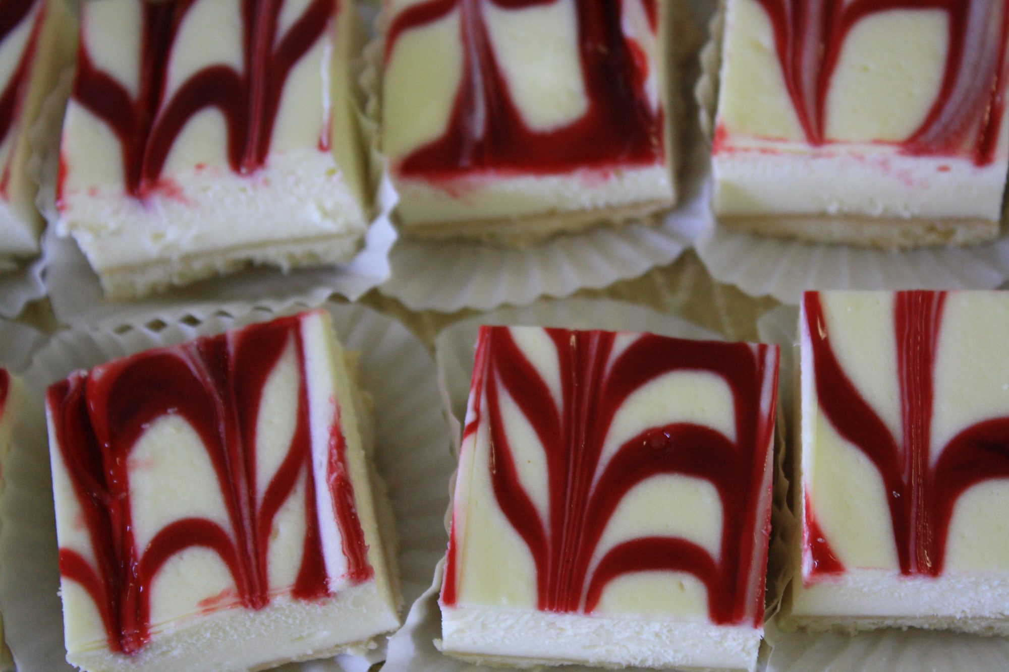 Raspberry swirl cheesecake bars